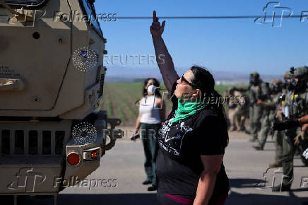 U.S. federal agents and immigration officers raid an agricultural facility in Camarillo