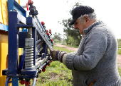 FILE PHOTO: Uruguay presidential candidate Mujica works on his farm after casting his vote during the Uruguayan National elections