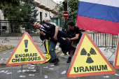 Activists of Greenpeace attend a protest near the Russian Embassy in Paris