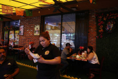 People eat at a Mexican restaurant in Los Angeles