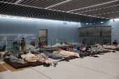 People shelter at Tel Aviv Light Rail Station amid ongoing Iranian ballistic missile threat