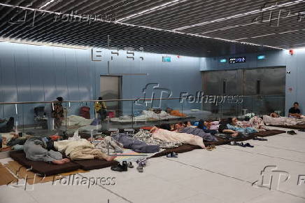 People shelter at Tel Aviv Light Rail Station amid ongoing Iranian ballistic missile threat