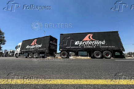 A truck carrying aid arrives at the Kerem Shalom crossing between Israel and Gaza, on its Israeli side