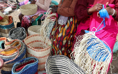 Women weave sisal and recycled polythene to make traditional handwoven basket known as Kiondo at the Mwariro Market in Kariokor district of Nairobi