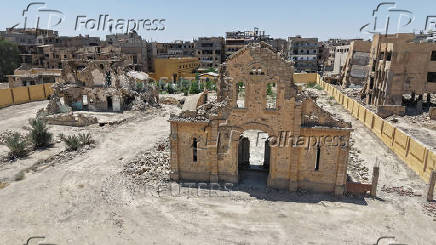 A drone view shows the damaged Christ the King Church in Deir el-Zor