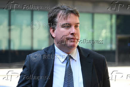 Former MP Craig Williams walks outside Southwark Crown Court in London