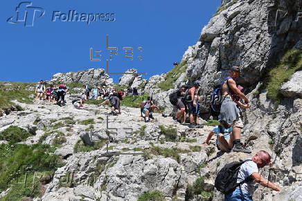 Hikers on the Giewont summit in the Tatra Mountains