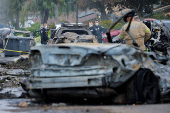 Crash scene after a civilian aircraft went down in a neighborhood, in San Diego