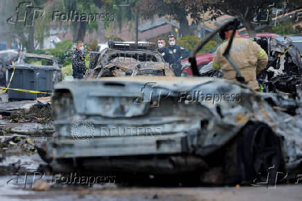 Crash scene after a civilian aircraft went down in a neighborhood, in San Diego