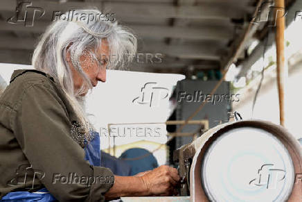 Multi-media artist and writer Lisa George does lapidary work at a local rock shop in Marfa