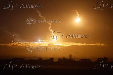 IDF flares light sky above Gaza seen from Israeli side