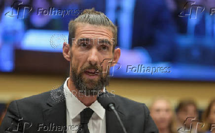FILE PHOTO: Olympic swimming great Michael Phelps, U.S. swimmer Allison Schmitt, and US Anti-Doping Agency CEO Travis Tygart testify at Capitol Hill