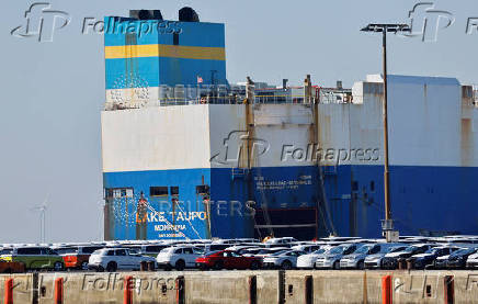 Cars of the Volkswagen Group are waiting to be exported to the US from the seaport of Emden