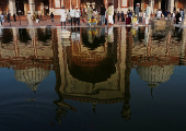 A muslim man performs ablution before offering prayers at Jama Masjid on the occasion of Eid al-Adha, in the old quarters of Delhi