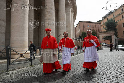 Cardinals Luis Jose Rueda Aparicio, Ruben Salazar Gomez and Jorge Enrique Jimenez Carvajal arrive to attend the first Mass to be led by Pope Leo XIV in the Sistine Chapel at the Vatican
