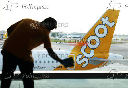 A Scoot plane sits on the tarmac at Changi Airport in Singapore