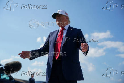 U.S. President Donald Trump boards Air Force One as he departs for Iowa, at Joint Base Andrews