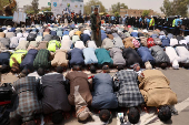 University students and professors perform prayers to ask for rain in Sanaa