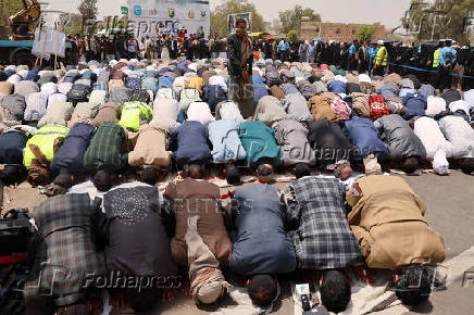 University students and professors perform prayers to ask for rain in Sanaa