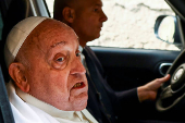 Pope Francis looks on as he leaves Regina Coeli prison after a visit, in Rome