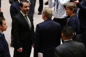 Britain?s Lord Collins of Highbury greets United Nations Secretary General Antonio Guterres ahead of U.N. Security Council meeting on Israel and Palestinian conflict