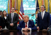 U.S. President Donald Trump signs executive orders at the White House in Washington