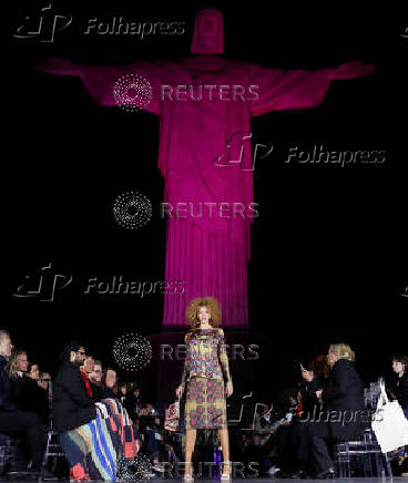 Models present creations by Alessa at the Christ the Redeemer statue to mark the launch of Rio Fashion Show, in Rio de Janeiro