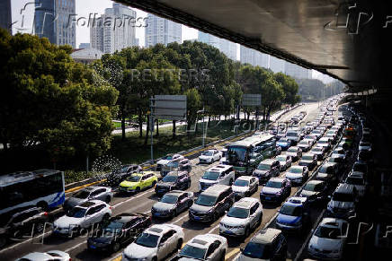 FILE PHOTO: Cars wait in traffic in Shanghai