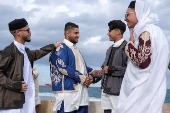 People gather to celebrate Eid wearing traditional Libyan outfits in Benghazi