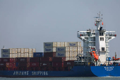 A container ship is seen near the Hai Phong International Container Terminal