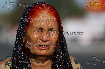 Pakistan citizen Wakeela cries as she talks to media as she and her relatives prepare to leave India after India revoked all visas issued to Pakistani citizens at the Attari-Wagah border crossing near Amritsar