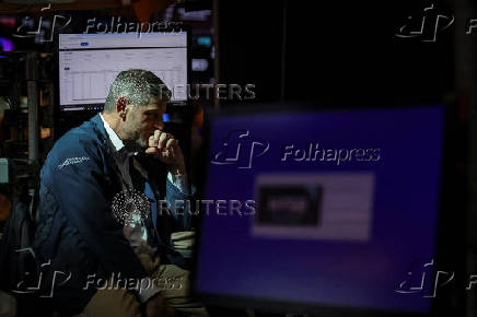 A trader works on the floor at the New York Stock Exchange (NYSE) in New York City