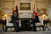Britain's Prime Minister Keir Starmer and Jordan's King Abdullah sit down for a meeting inside 10 Downing Street, in London