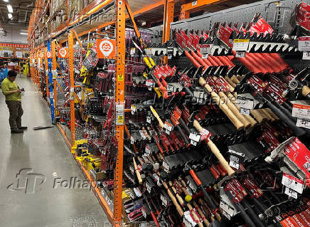 A man shops in the tool section of a Home Depot in Washington