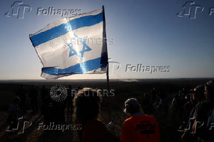 Israeli right wing activists take part in a rally organized by settlers groups to promote Israel's resettling in Gaza