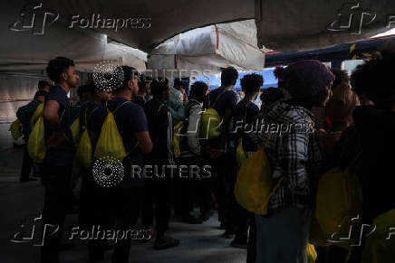 Rescued migrants arrive aboard Sea-Watch 5 ship in Salerno