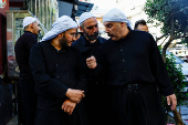 Fahed Abu Haidar, resident of Jaramana, speaks to Mwaffaq Abu Shash, a Druze cleric, following deadly clashes between Sunni fighters against armed Druze residents, Jaramana,