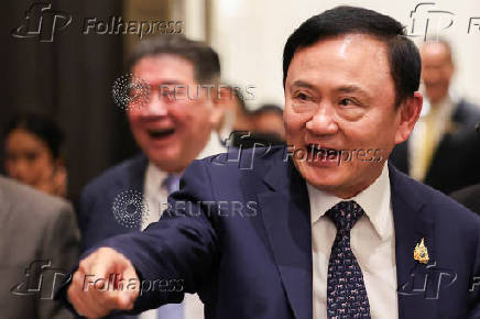 Thailand?s former Prime Minister Thaksin Shinawatra reacts ahead of a panel discussion with Thai broadcaster Nation TV, in Bangkok