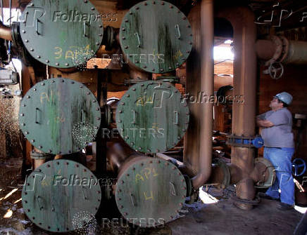 FILE PHOTO: A worker stands inside Santa Elisa ethanol distillery in Sertaozinho