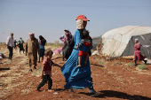 People gather on land between Deraa and Sweida after Druze unrest