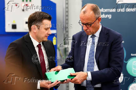 German Chancellor Friedrich Merz visits a battery cell production facility in Muenster
