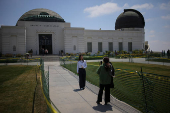 Visitors take pictures at the Griffith Observatory in Los Angeles