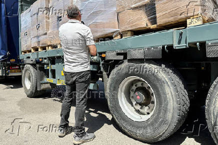 Trucks carrying aid are seen at the Kerem Shalom crossing between Israel and Gaza, on its Israeli side