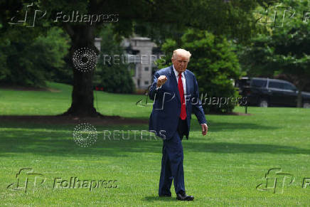 U.S. President Donald Trump arrives at the White House, in Washington