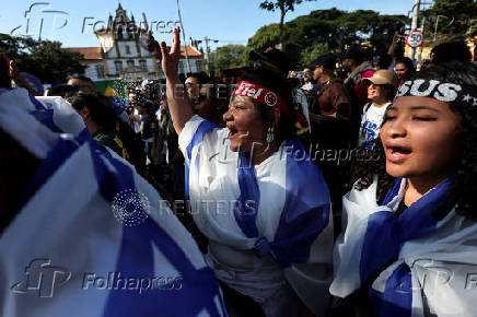 Brazilians attend an evangelical march to celebrate Corpus Christi in Sao Paulo