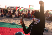 Pro-Palestinian protesters demonstrate on the Zuiderstrand beach against the violence in Gaza