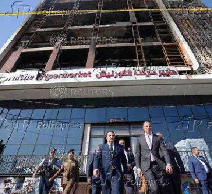 Iraqi Prime Minister visits a five-storey shopping centre after a massive overnight fire killed multiple people, in Al-Kut