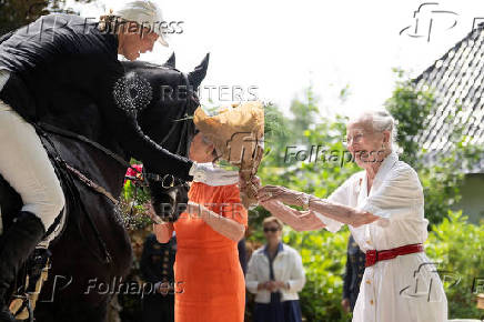 Denmark's Queen Margrethe receives the Graasten Ringrider Association's procession