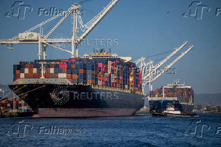 FILE PHOTO: A cargo ship full of shipping containers is seen at the port of Oakland, California