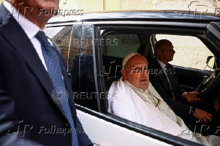 Pope Francis looks on as he leaves Regina Coeli prison after a visit, in Rome
